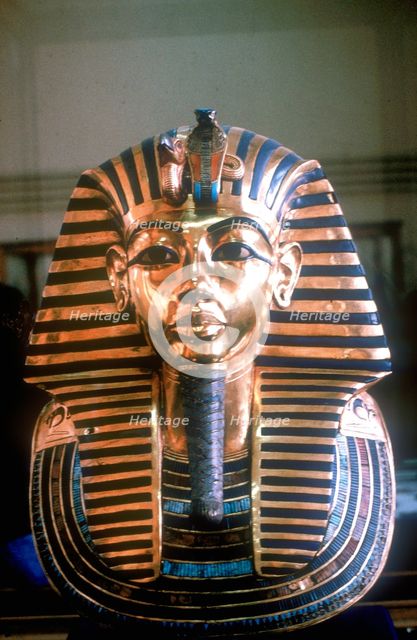 Gold mask of Tutankhamun on his mummy-case. Artist: Unknown
