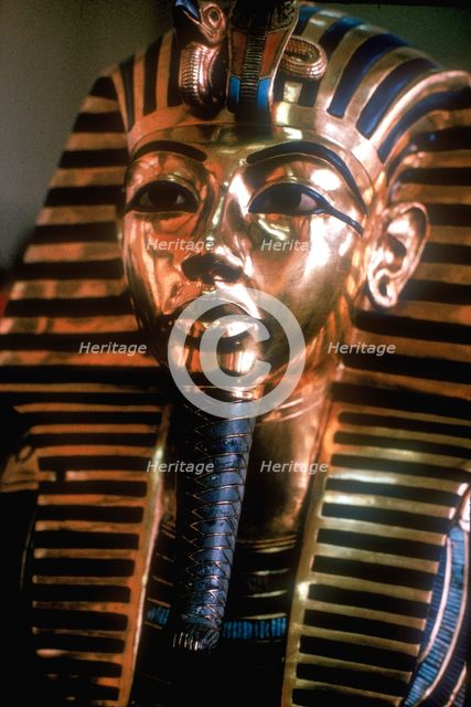 Gold mask of Tutankhamun on his mummy-case. Artist: Unknown