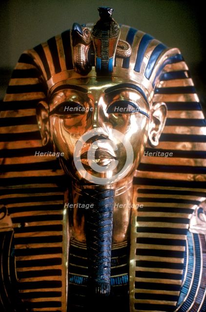 Gold mask of Tutankhamun on his mummy-case. Artist: Unknown