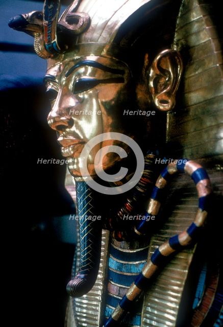 Gold mask of Tutankhamun on the second coffin. Artist: Unknown