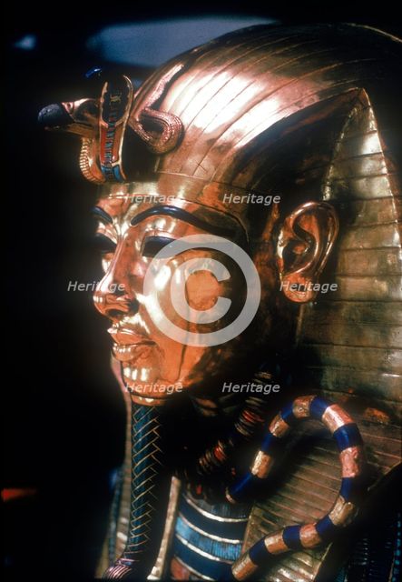 Gold mask of Tutankhamun on the second coffin. Artist: Unknown