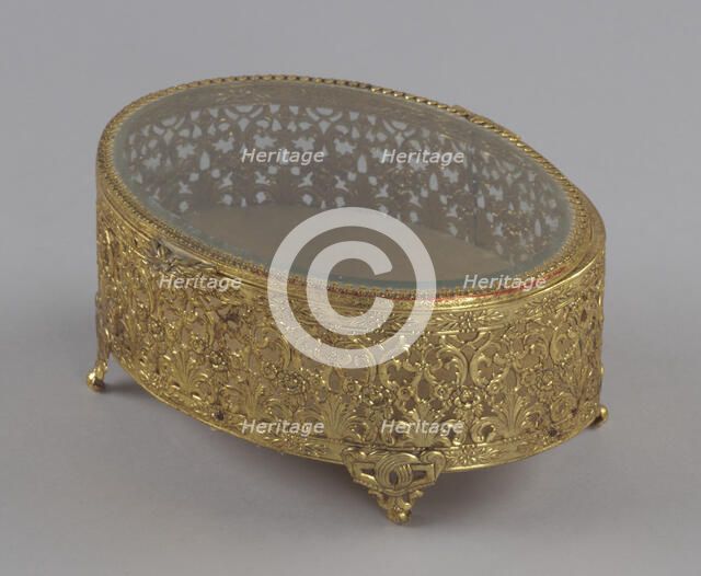 Gold metal scrollwork jewelry box from Mae's Millinery Shop, 1941-1994. Creator: Unknown.