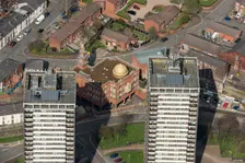 Golden Mosque overshadowed by two of the Seven Sisters towers, Rochdale, 2019. Creator: Historic England