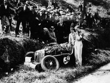 Goldie Gardner by the wreckage of an MG J4, 1932