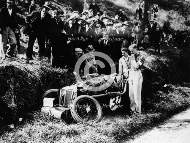 Goldie Gardner by the wreckage of an MG J4, 1932. Artist: Unknown