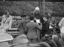 Goldie Gardner signing autographs at the Irish Grand Prix, Phoenix Park, Dublin, 1930. Artist: Bill Brunell