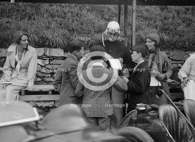Goldie Gardner signing autographs at the Irish Grand Prix, Phoenix Park, Dublin, 1930. Artist: Bill Brunell.