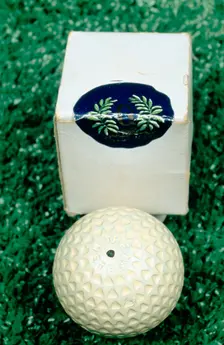 Golf ball and box, c1910. Creator: Unknown