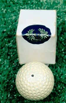 Golf ball and box, c1910. Creator: Unknown