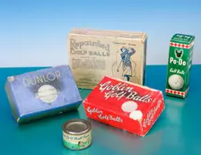 Golf ball boxes and tin of golf ball paint, 1920-1930. Creator: Unknown