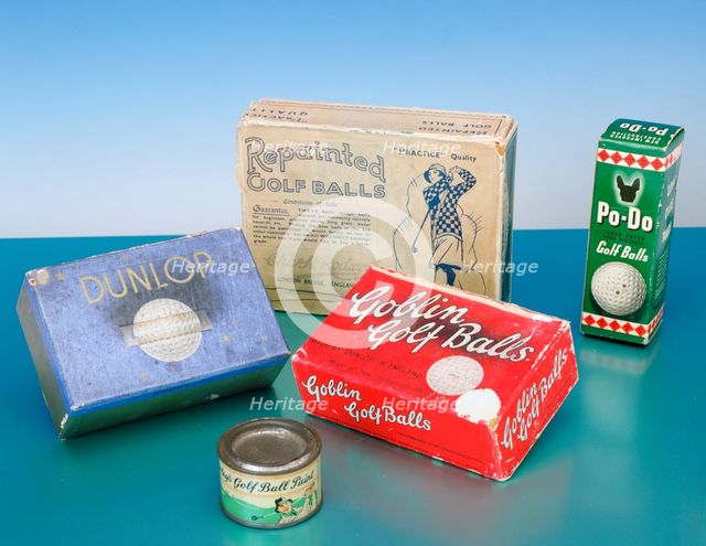 Golf ball boxes and tin of golf ball paint, 1920-1930. Creator: Unknown.