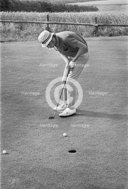 Golfer putting, Sweden, 1969. Creator: Unknown.