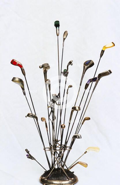 Golfing hatpins and pin holder. Artist: Unknown