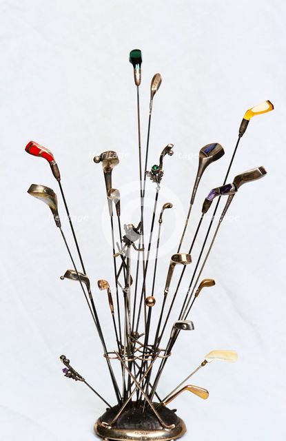 Golfing hatpins and pin holder. Creator: Unknown.