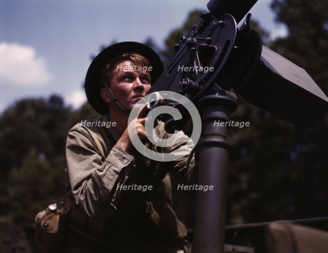 Good man, good gun: a private of the armored forces does some practice..., Fort Knox, Ky., 1942. Creator: Alfred T Palmer.
