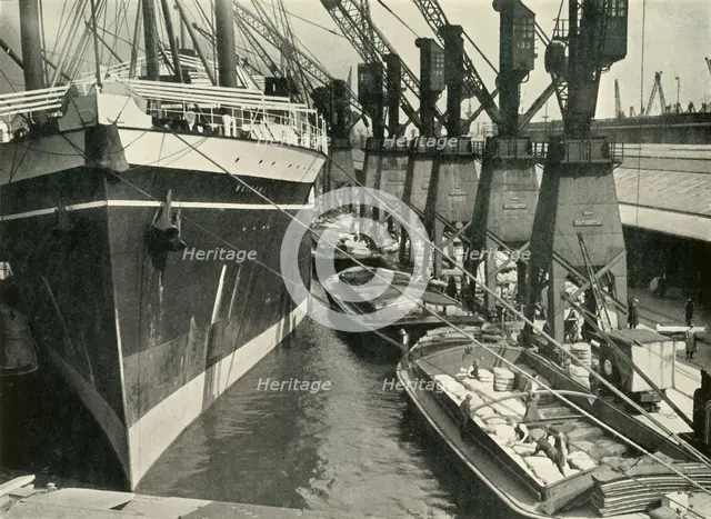 "Goods of Whatever Sort Find Here the Appropriate Facilities for Unloading, Storage and..., 1937. Creator: J Dixon-Scott.