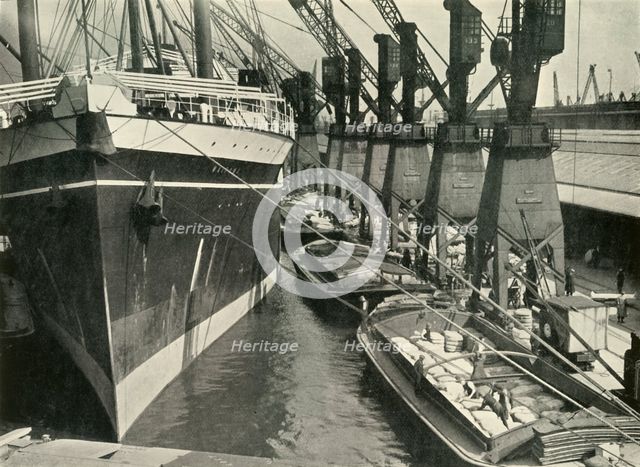"Goods of Whatever Sort Find Here the Appropriate Facilities for Unloading, Storage and..., 1937. Creator: J Dixon-Scott.