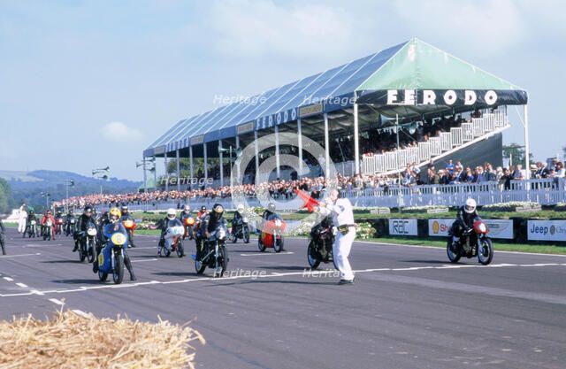 Goodwood revival meeting. Motorcycle race starting grid. Artist: Unknown.