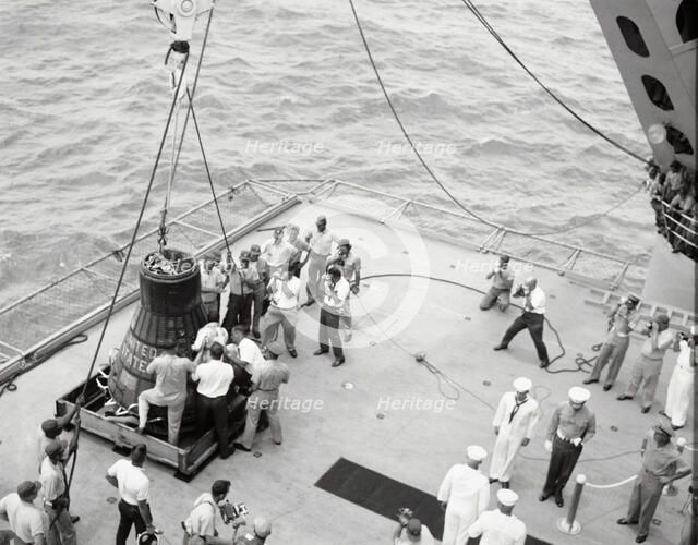 Gordon Cooper and capsule on deck, Pacific Ocean, 1963.  Creator: NASA.