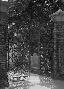 Gates on Broad Street to the graveyard at St. Michael's Episcopal Church, Charleston..., c1920-1926. Creator: Arnold Genthe