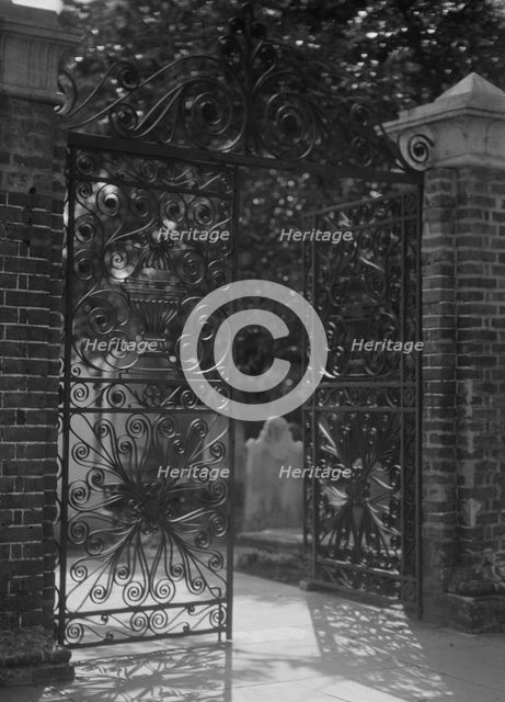 Gates on Broad Street to the graveyard at St. Michael's Episcopal Church, Charleston..., c1920-1926. Creator: Arnold Genthe.