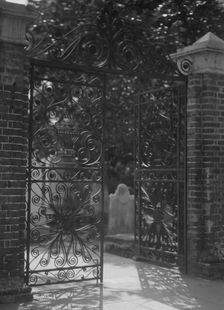 Gates on Broad Street to the graveyard at St. Michael's Episcopal Church, Charleston..., c1920-1926. Creator: Arnold Genthe