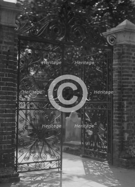 Gates on Broad Street to the graveyard at St. Michael's Episcopal Church, Charleston..., c1920-1926. Creator: Arnold Genthe.
