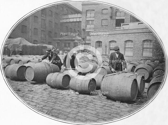 Gauging wine casks at London Docks, c1900 (1901). Artist: Unknown.