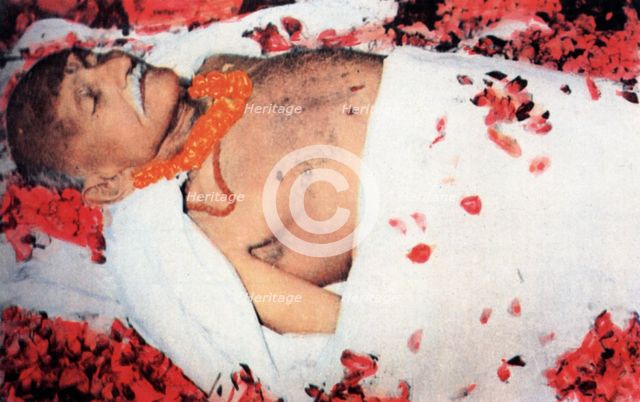 Gandhi's body strewn with flowers, 1948. Artist: Anon