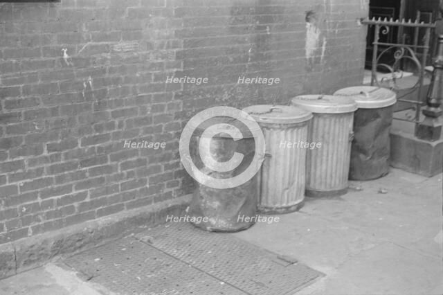 Garbage cans, 61st Street between 1st and 3rd Avenues, New York, 1938. Creator: Walker Evans.
