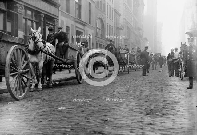 Garbage carts protected by police, 1911. Creator: Bain News Service.