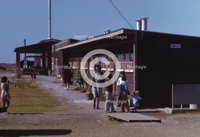 Gardens are planted in front of the row shelters, FSA ... labor camp, Robstown, Tex., 1942. Creator: Arthur Rothstein.