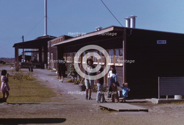Gardens are planted in front of the row shelters, FSA ... labor camp, Robstown, Tex., 1942. Creator: Arthur Rothstein.