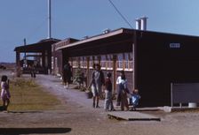 Gardens are planted in front of the row shelters, FSA ... labor camp, Robstown, Tex., 1942. Creator: Arthur Rothstein