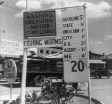 Gas station price analysis, Santa Fe, New Mexico, 1938. Creator: Dorothea Lange