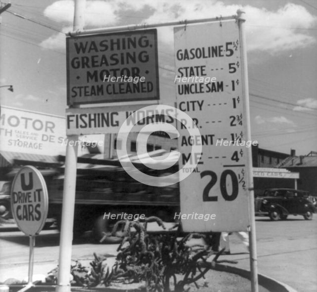 Gas station price analysis, Santa Fe, New Mexico, 1938. Creator: Dorothea Lange.