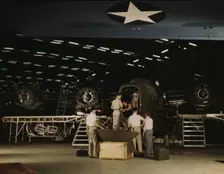 Getting a nose door ready to put on a C-87...Consolidated Aircraft Corp..., Fort Worth, Texas, 1942. Creator: Howard Hollem