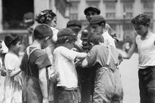 Getting drinks on hot day, between c1910 and c1915. Creator: Bain News Service