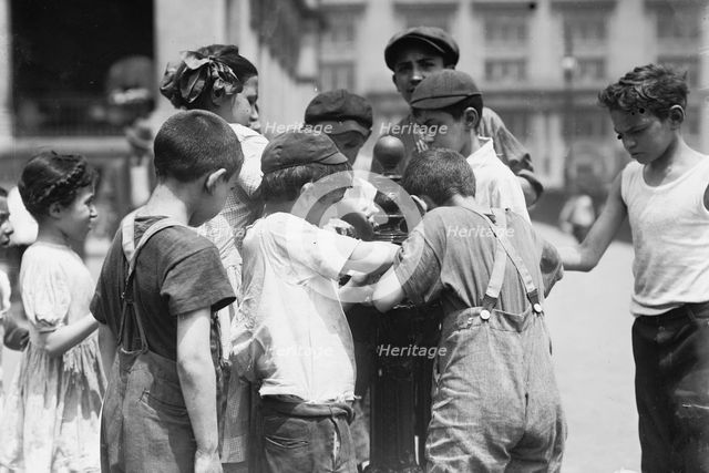 Getting drinks on hot day, between c1910 and c1915. Creator: Bain News Service.