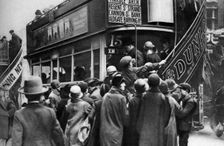 Getting on a bus in Ludgate Hill, London, 1926-1927