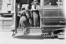 Getting on Brdway car, between c1910 and c1915. Creator: Bain News Service