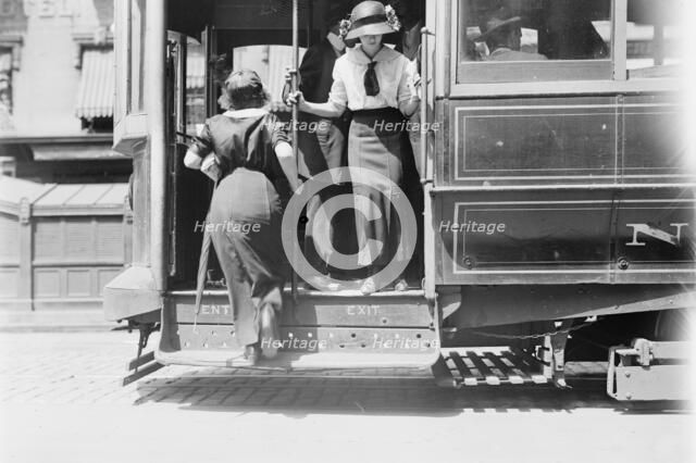 Getting on Brdway car, between c1910 and c1915. Creator: Bain News Service.