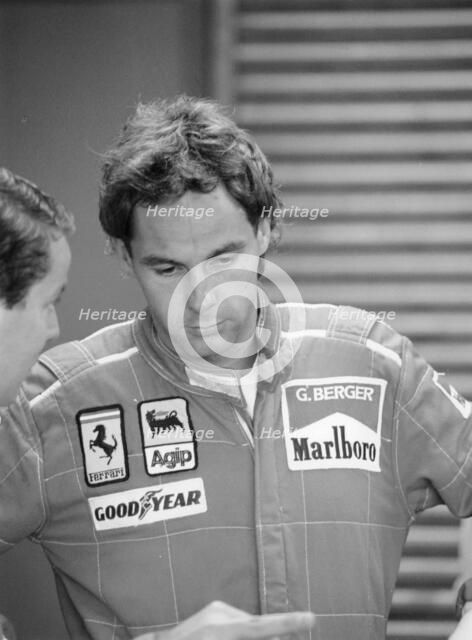 Gehard Berger listening to a member of the Ferrari team, 1988. Artist: Unknown