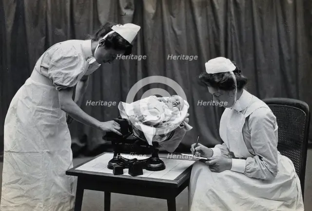 General Lying In Hospital, York Road, Lambeth: nurses weighing a baby, 1906 Creator: Unknown.