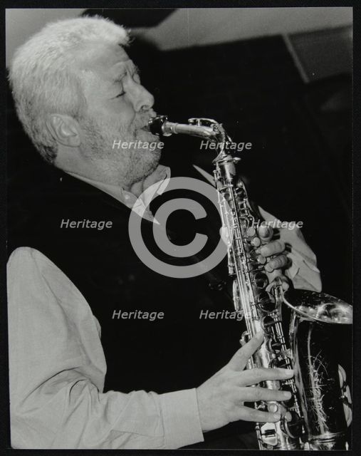 Geoff Simkins playing alto saxophone at The Fairway, Welwyn Garden City, Hertfordshire, 2002. Artist: Denis Williams