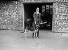 Geoffrey Baker and his alsatian. Artist: Bill Brunell