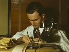 Geologist examining cuttings from wildcat well, Amarillo, Texas, (1943?). Creator: John Vachon