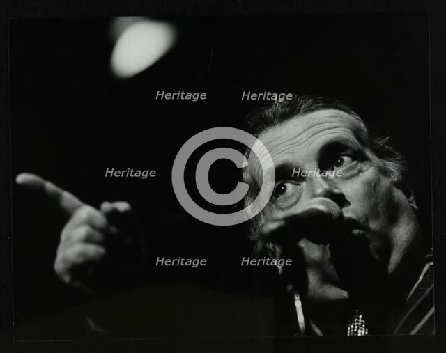 George Melly on stage at the Forum Theatre, Hatfield, Hertfordshire, 8 April 1983. Artist: Denis Williams