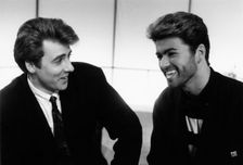 George Michael, British pop singer, and Jonathan Ross, British comedian and TV personality. Creator: Unknown
