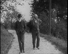 George Bernard Shaw Walking Down a Country Lane With a Male Civilian, 1920s. Creator: British Pathe Ltd